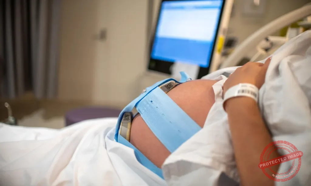 Birth injury attorney reviewing childbirth negligence case with parents